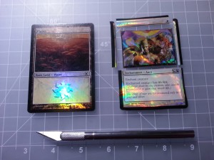 The foil layer cut apart, isolating the art